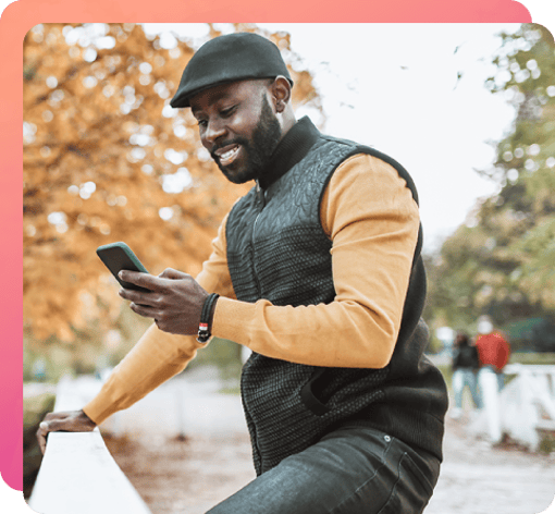 Man is getting calls on a walk Man looking at his phone while walking on a crisp autumn day